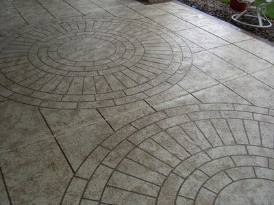 Image of circular tile pattern cut on patio.